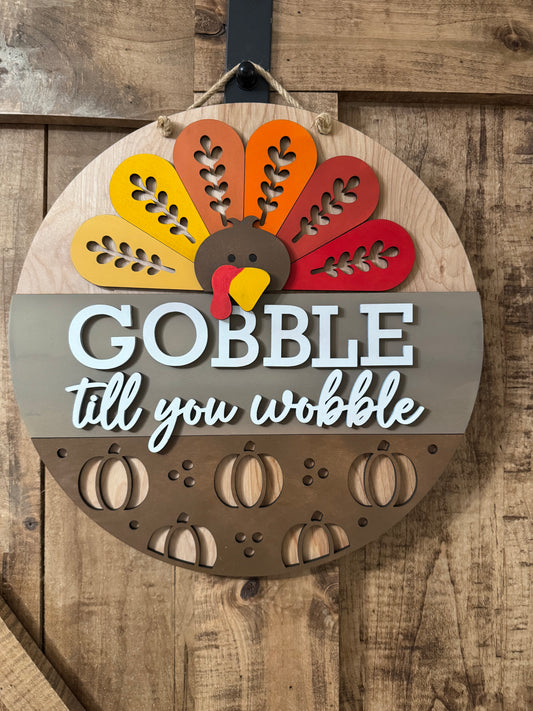 Gobble till You Wobble Round Sign